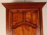 a wooden cabinet with a mirror on top of it