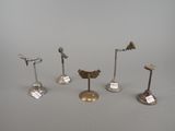 several different types of metal objects on display on a table