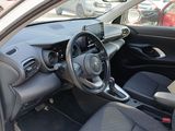 the interior of a small car with a steering wheel and dashboard