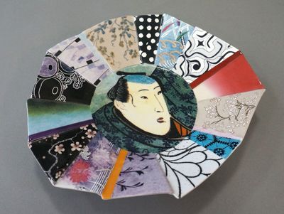 a plate with a picture of a woman on it