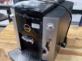 a coffee machine that is sitting on a wooden table