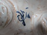 a close up of a ceramic figurine of a woman