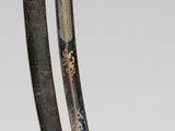 pair of two swords, one with a gold handle and the other with a black handle