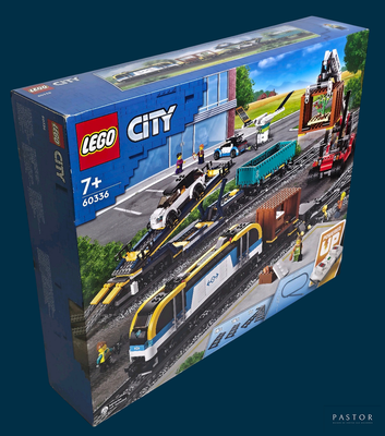 a box with a lego city train set in it