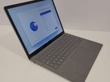 a laptop that is sitting on a white table