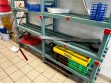 a shelf with baskets on it in a kitchen