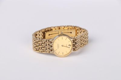 an image of a close up of a wrist watch on a white surface