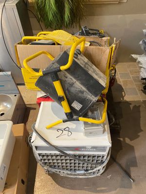 a pile of appliances and a sink in a room