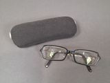 a pair of glasses and a case sitting on a table