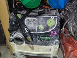 a pile of assorted items on the floor of a garage