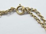 an image of a close up of a gold chain bracelet