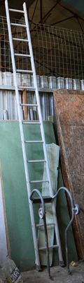 a ladder that is leaning against a building