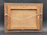 an old wooden frame with a rope hanging from it ' s side