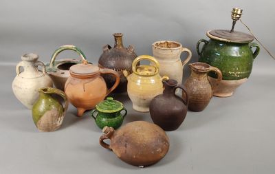 many different types of vases sitting on a table
