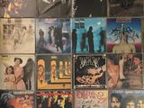 a lot of different album covers on the wall