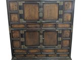 a wooden chest of drawers with many drawers on top of it