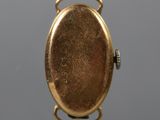 an image of a close up of a gold plated pocket watch