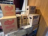 several boxes of wine are stacked on top of each other on a shelf