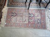 a rug on the floor in a room with two chairs