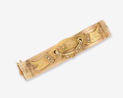 une image représentant un bracelet en or serti de diamants sur fond blanc
