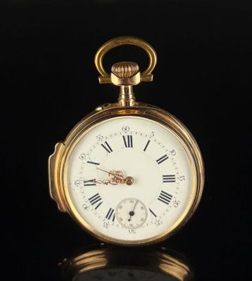 a gold pocket watch with roman numerals on the face