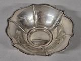 a silver bowl that is sitting on a table