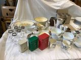 a table with a lot of dishes and cups on it