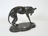 an image of a statue of a dog on a base
