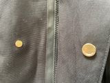 a close up of a jacket with a button on it