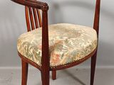 an image of a wooden chair with a floral upholstered seat