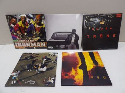 three cds of various albums of various music on a white surface