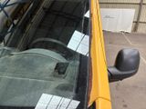 a close up of a car ' s windshield with a sticker on it