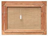 an old picture frame with a white feather hanging from it ' s side