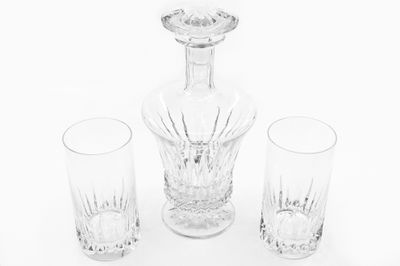 three glasses and a decanter on the table