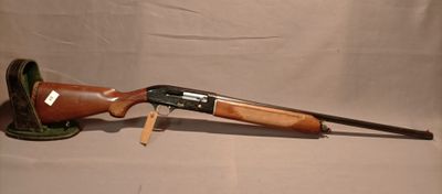 a rifle with a wooden handle and a wooden barrel