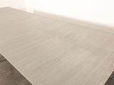 an image of a table with a white top in a room