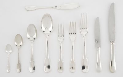 a lot of silver spoons and forks on the table
