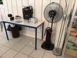 a table with a fan on it in a room