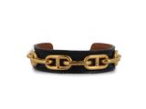 a black leather bracelet with gold chains and a gold clasp