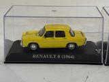 a yellow car in a clear case on a white surface