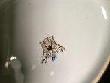 a close up view of a bowl with a bird on it