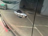 a close up of a car ' s door handle and door handle