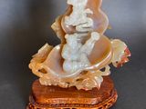chinese carved jade figurine of a woman on a shell