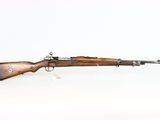 a rifle with a wooden barrel on a white background