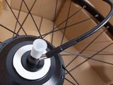 a bicycle wheel that is in a cardboard box