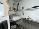 pots and pans are lined up on the counter in a kitchen