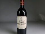 a bottle of wine that is sitting on a table
