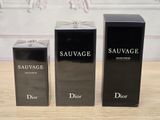 three bottles of perfume sitting on top of a table next to each other