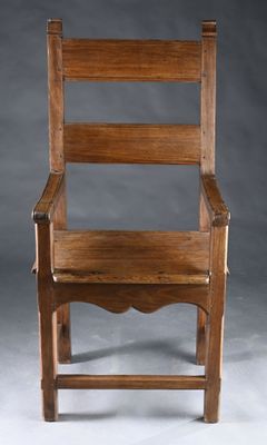 an old wooden chair sitting on top of a white floor