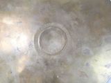 a large metal plate with a circular design on it